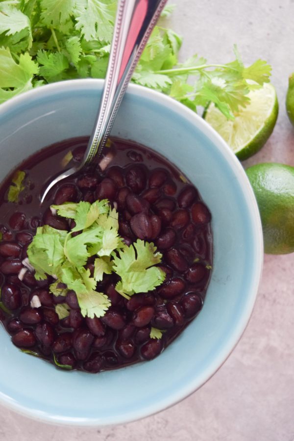 Sometimes you just need an easy way to doctor up canned black beans for taco night- this is your recipe! Cilantro Lime Black Beans are so easy to throw together in a pinch.