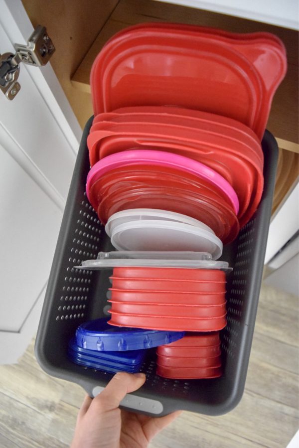 Organize Tupperware on A Budget: Stop the cabinet Tupperware avalanches and use this simple system to learn how to organize Tupperware for less than $10!