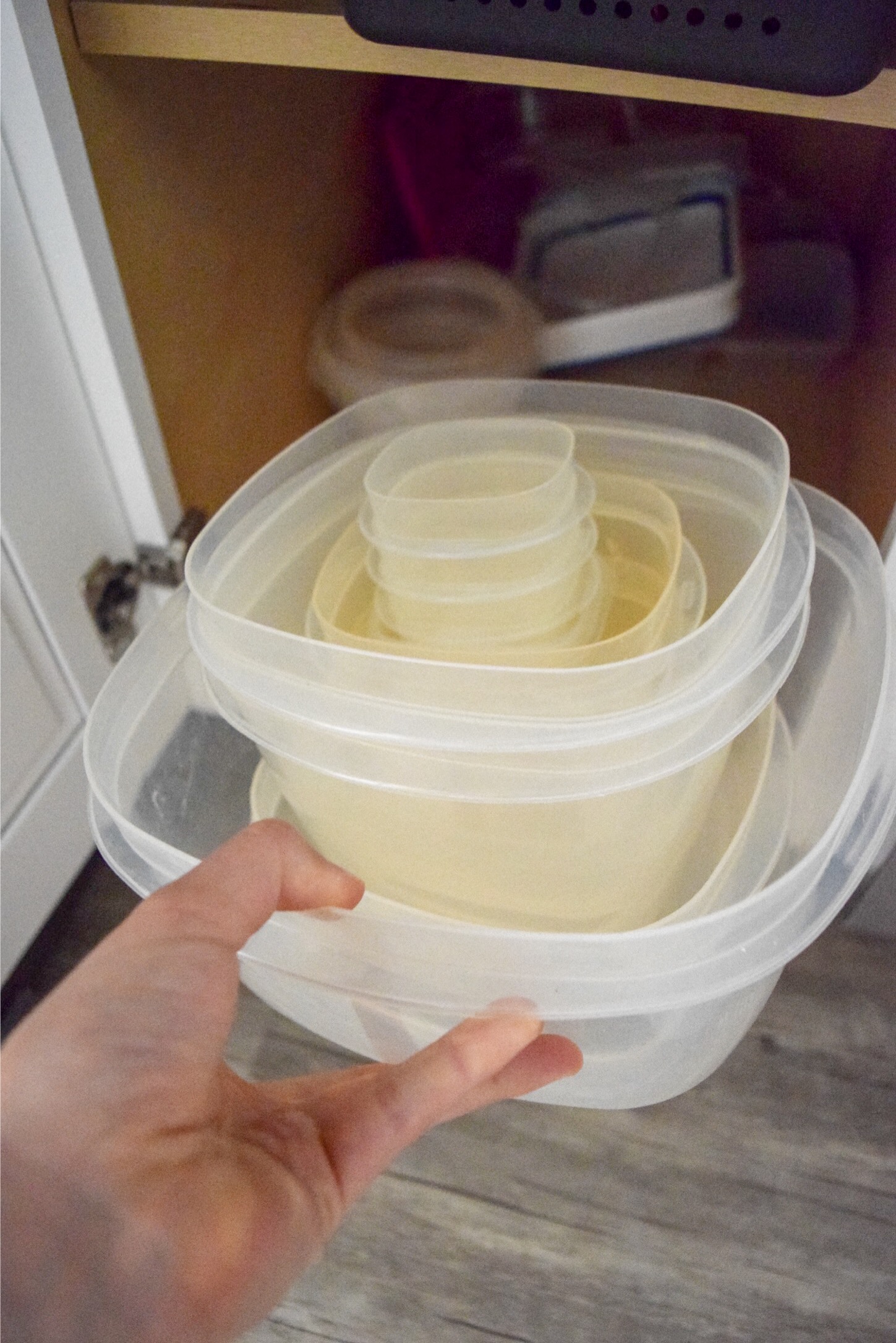 Organize Tupperware on A Budget: Stop the cabinet Tupperware avalanches and use this simple system to learn how to organize Tupperware for less than $10!