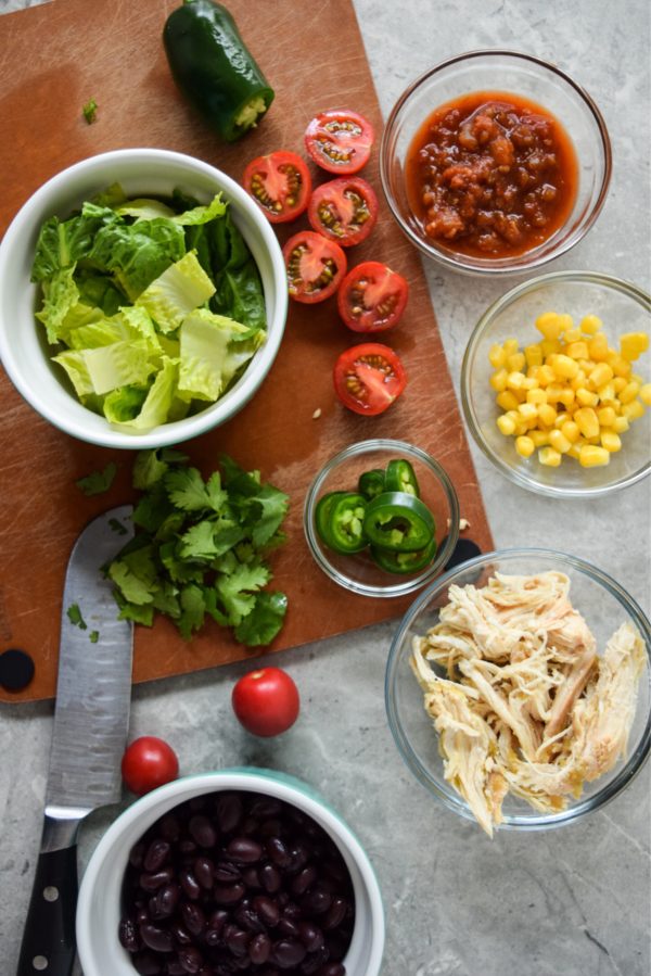 This Southwest Chicken Salad is so easy to make for meal prep! Love that you can layer it all and take it to go!