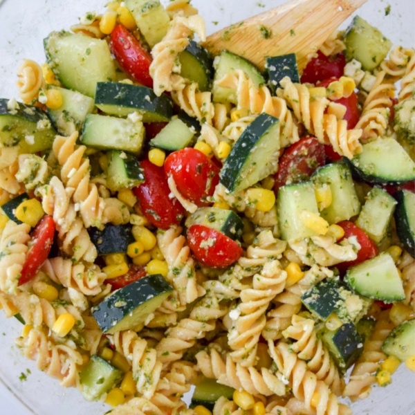 This Corn, Feta & Pesto Pasta Salad is the perfect summer twist on a pasta salad! Perfect for an easy side for a BBQ or add some protein to it for a complete meal!
