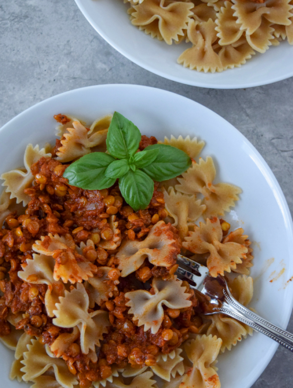 This One-Skillet Spicy Lentil Bolognese is perfect for a #meatlessmonday or vegetarian meal! Protein-packed lentils sub in for ground beef in this cozy pasta dish. Use your favorite jarred pasta sauce and any pasta you have on hand for this quick weeknight meal!