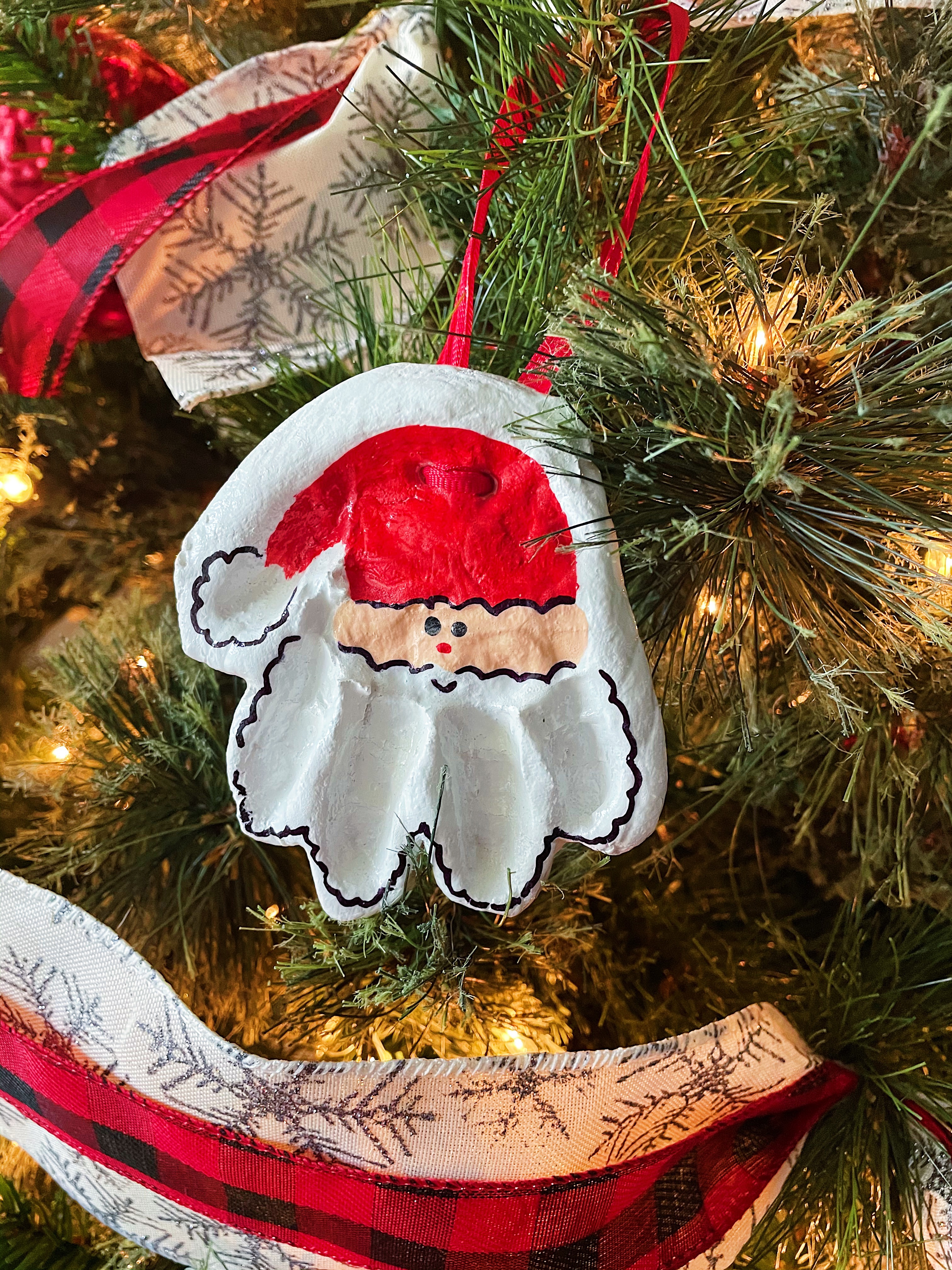 Santa Handprint Salt Dough Ornament hanging on christmas tree